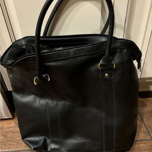 New black briefcase. Can be used as an oversized purse also.